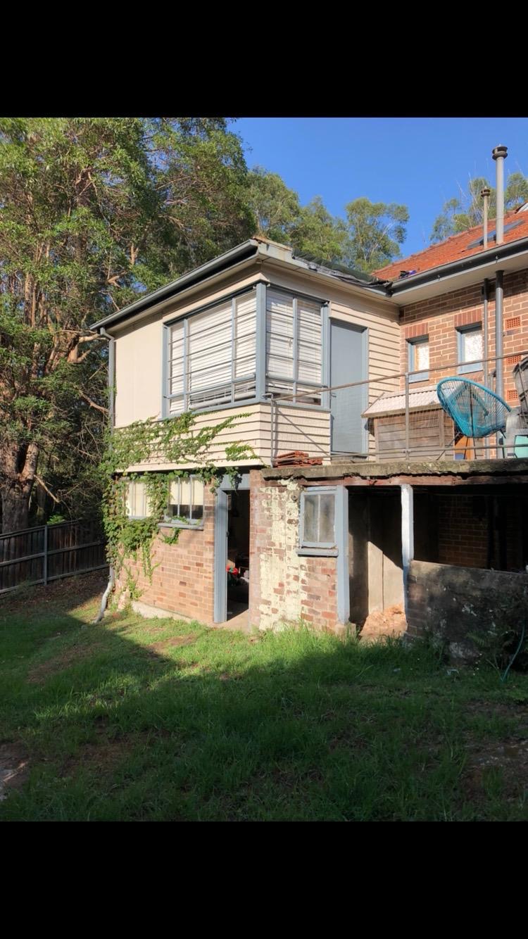 Weatherboard and brick house exterior before renovation stripout commenced